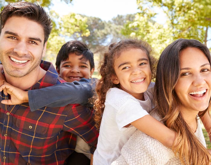 smiling family of four