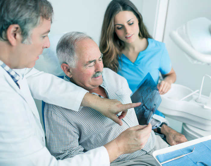 dentist explaining procedure to patient